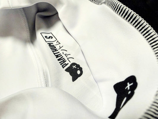 Athlete wearing a long-sleeve sublimated polyester rashguard for BJJ training